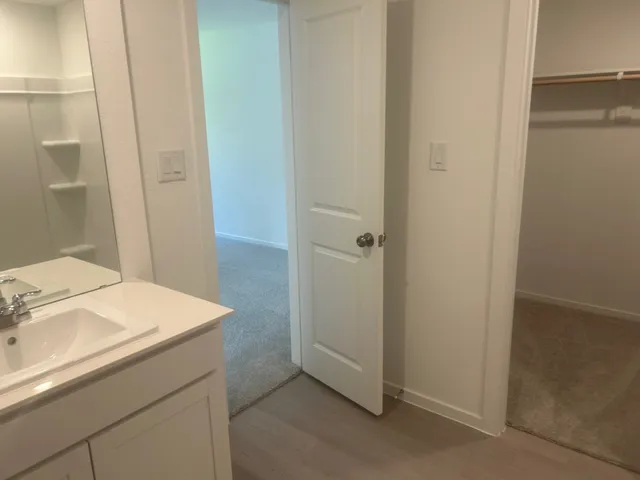 a bathroom with a sink and vanity