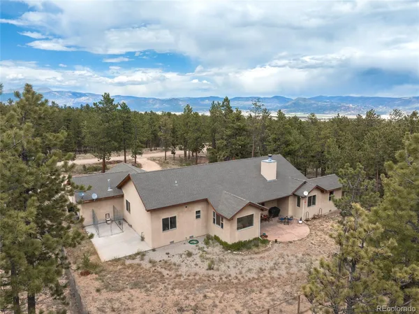 an aerial view of a house with a garden space
