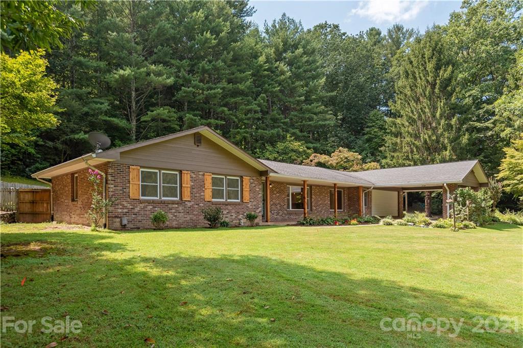 160 Cold Springs Road Hendersonville, NC 28792 - Photo 1 of 26 a front view of house with yard and green space