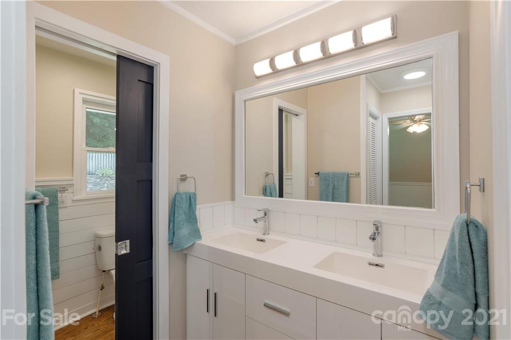 160 Cold Springs Road Hendersonville, NC 28792 - Photo 15 of 26 a bathroom with a sink and a mirror