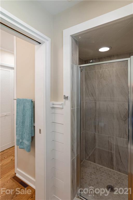 160 Cold Springs Road Hendersonville, NC 28792 - Photo 16 of 26 a bathroom with a glass shower door