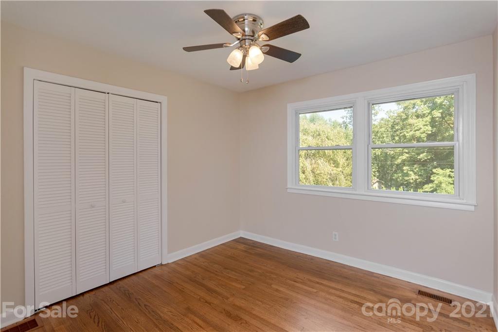 160 Cold Springs Road Hendersonville, NC 28792 - Photo 17 of 26 a view of a room with a window and a ceiling fan