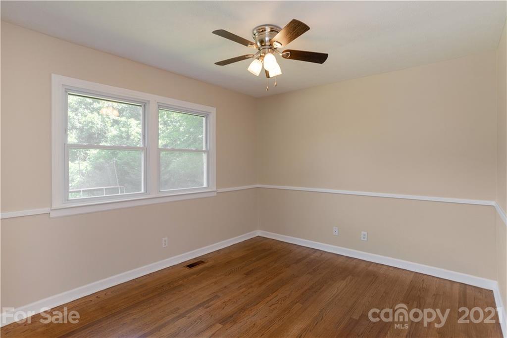 160 Cold Springs Road Hendersonville, NC 28792 - Photo 19 of 26 wooden floor in an empty room with a window
