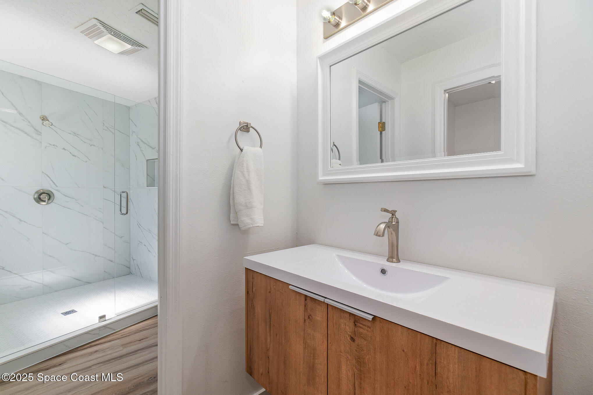 1905 Redwood Avenue Melbourne Beach, FL 32951 - Photo 11 of 15 a bathroom with a sink and a mirror