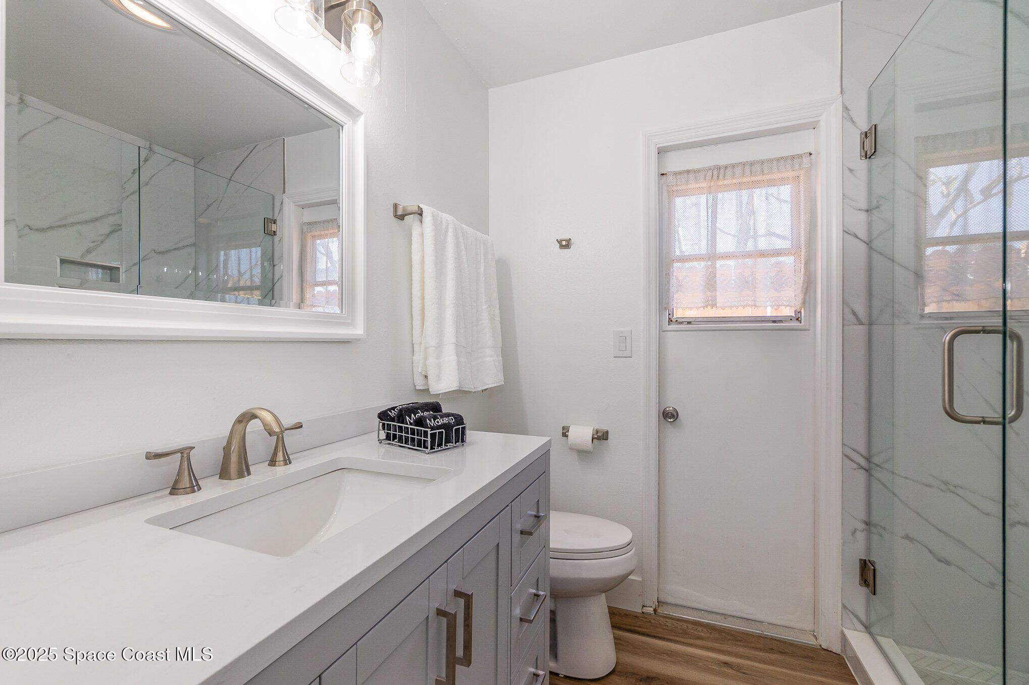 1905 Redwood Avenue Melbourne Beach, FL 32951 - Photo 14 of 15 a bathroom with a sink toilet and shower