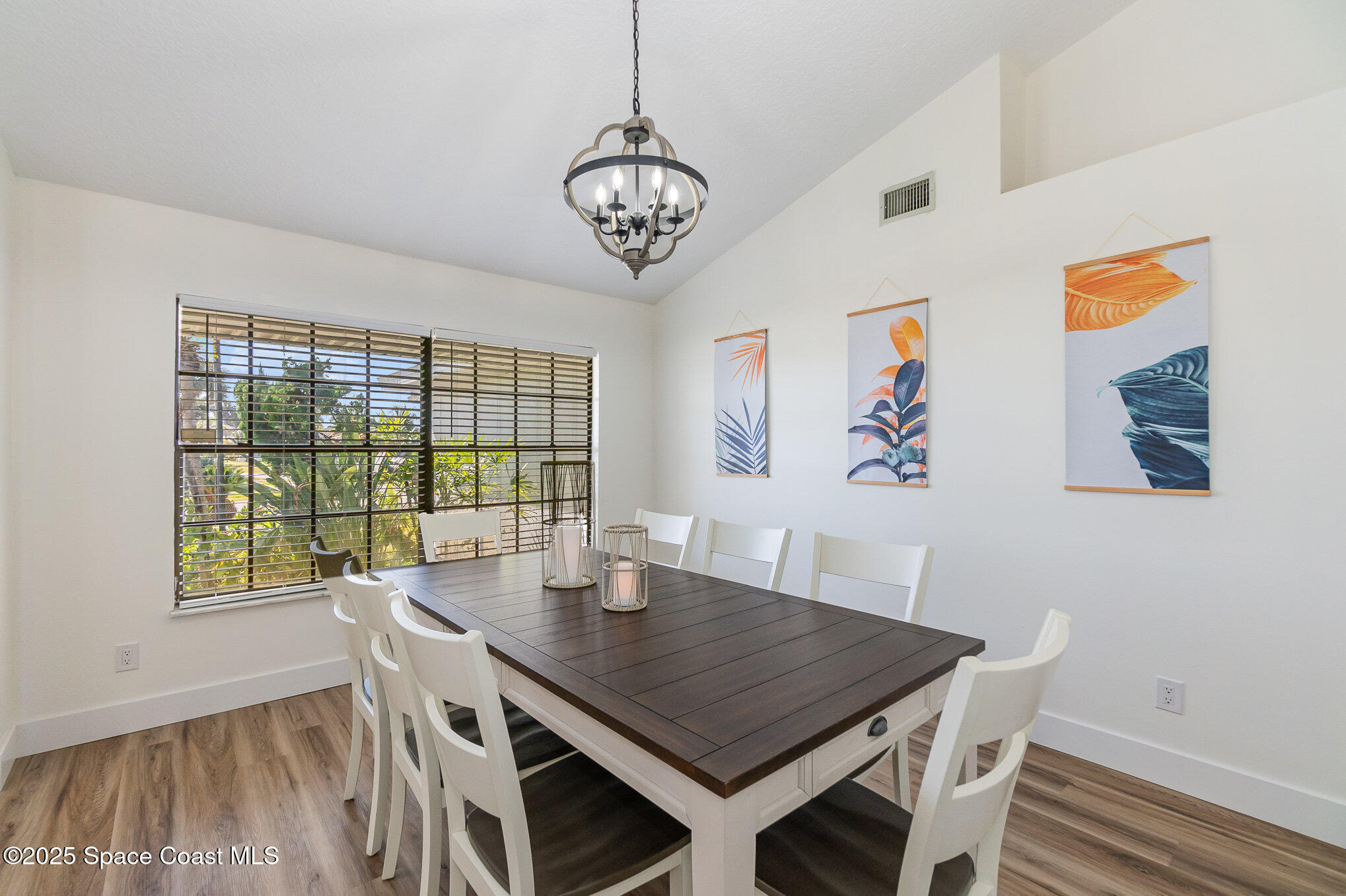 1905 Redwood Avenue Melbourne Beach, FL 32951 - Photo 3 of 15 a view of a dining room with furniture window and wooden floor