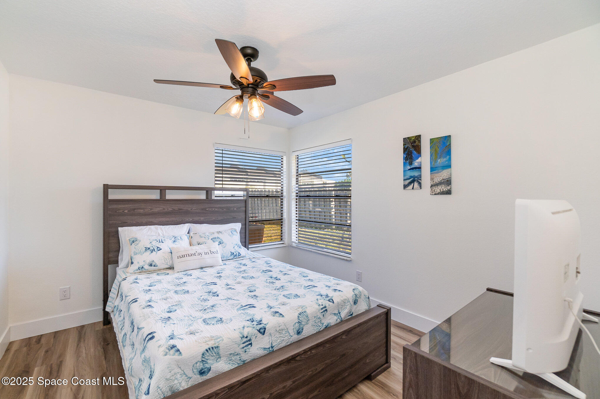 1905 Redwood Avenue Melbourne Beach, FL 32951 - Photo 5 of 15 a bedroom with a bed and a window