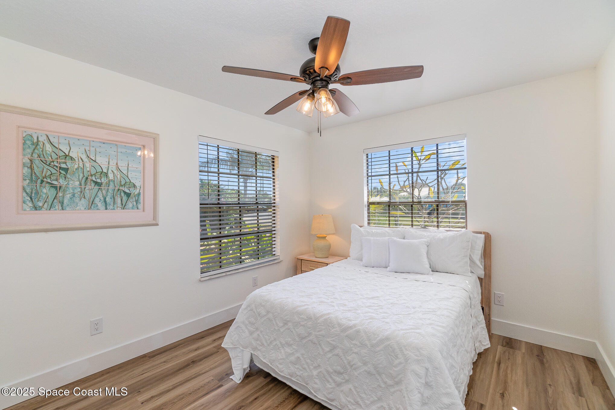 1905 Redwood Avenue Melbourne Beach, FL 32951 - Photo 6 of 15 a bedroom with a bed and a window