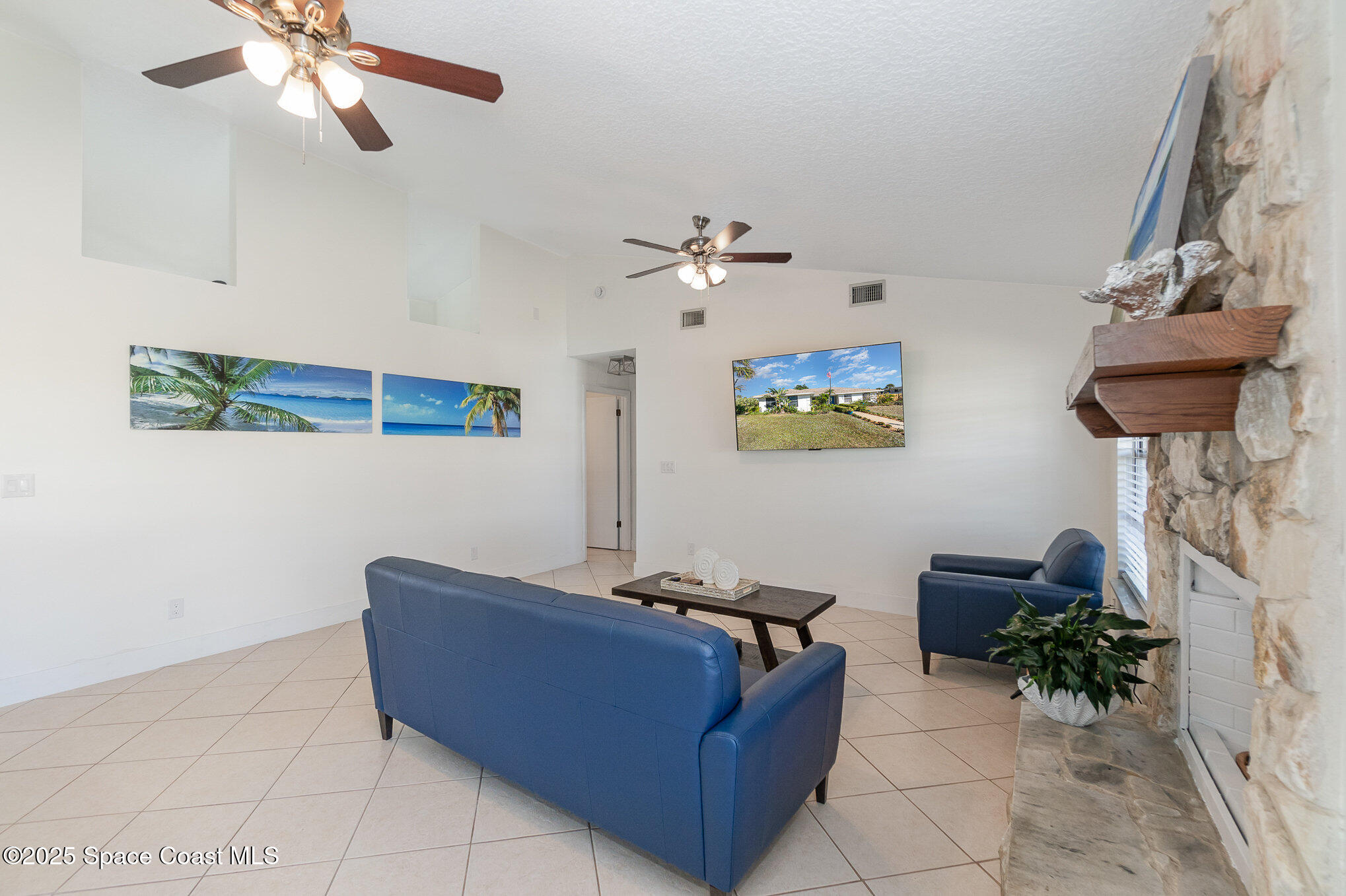 1905 Redwood Avenue Melbourne Beach, FL 32951 - Photo 10 of 15 a living room with furniture and a chandelier