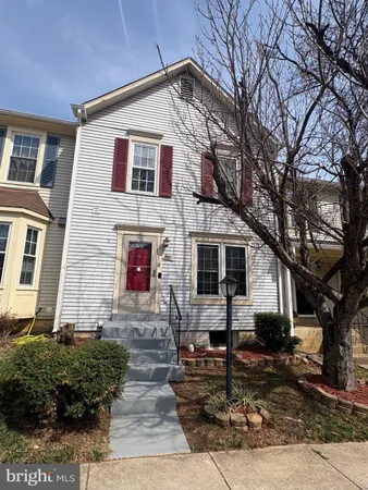 a front view of a house with stairs