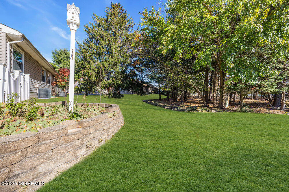 5B Spring Street, Unit B Whiting, NJ 08759 - Photo 28 of 39 a view of a house with a big yard