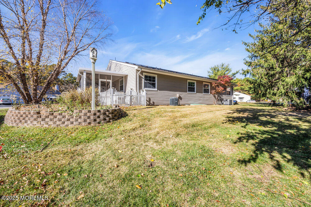 5B Spring Street, Unit B Whiting, NJ 08759 - Photo 33 of 39 a front view of a house with a yard