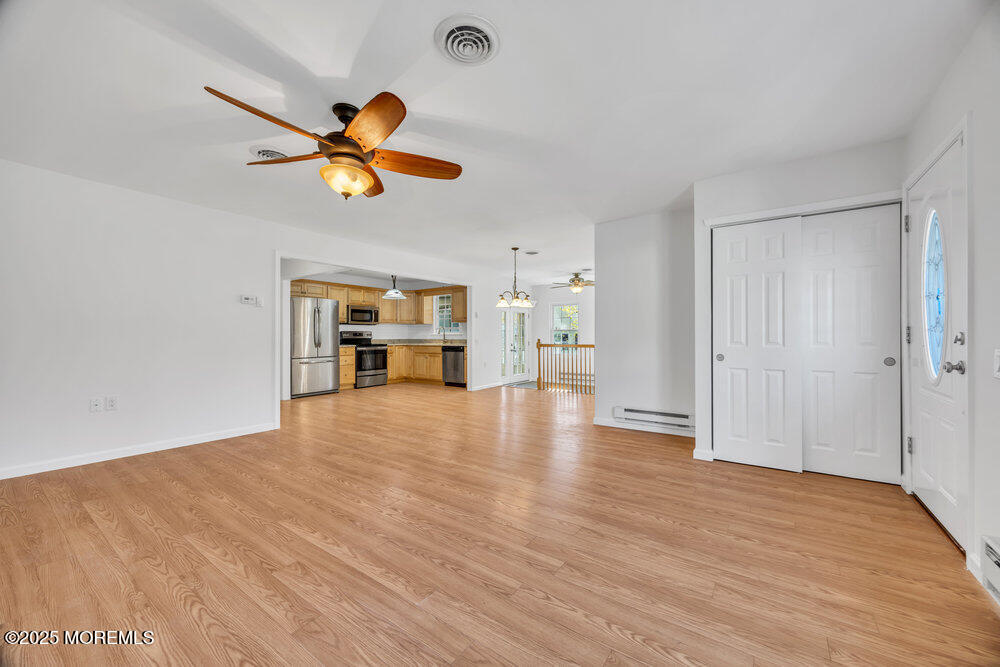 5B Spring Street, Unit B Whiting, NJ 08759 - Photo 7 of 39 a view of empty room with wooden floor and ceiling fan