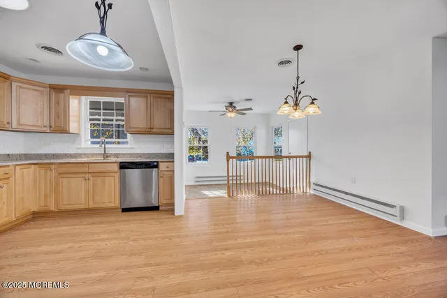 a view of a kitchen with a sink cabinets and window