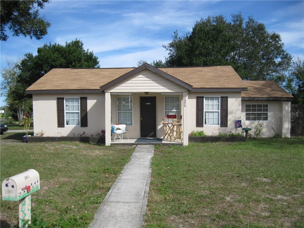 1301 Golconda Road Lakeland, FL 33801 - Photo 1 of 1 a front view of a house with a garden