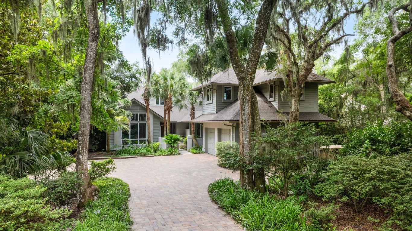 10 Sea Marsh Road Amelia Island, FL 32034 - Photo 1 of 78 a front view of a house with a yard and tree s