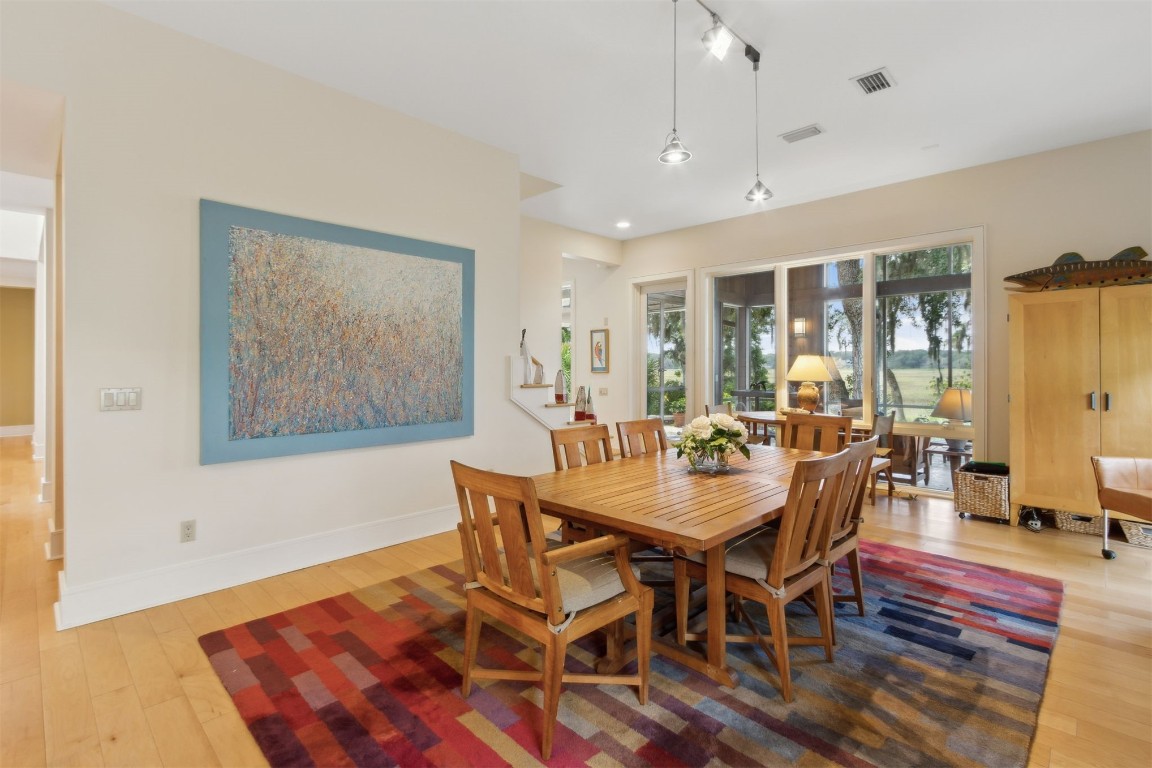 10 Sea Marsh Road Amelia Island, FL 32034 - Photo 14 of 78 a view of a dining room with furniture window and wooden floor