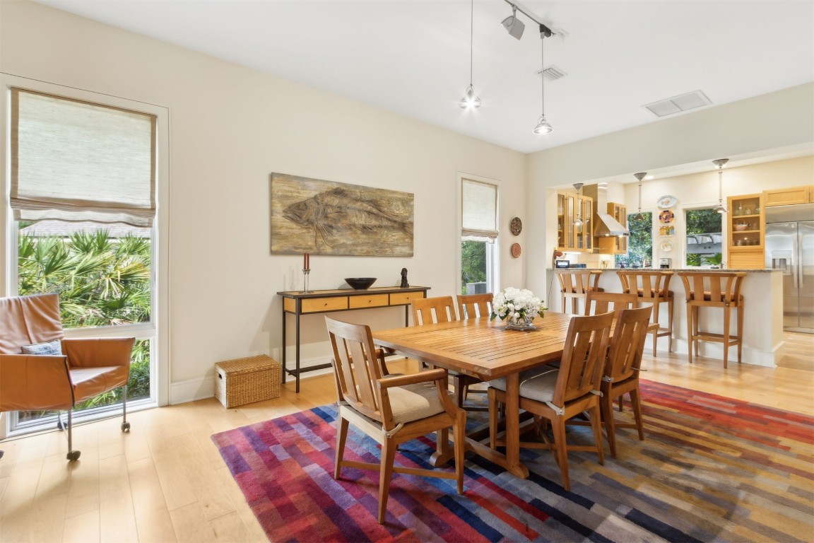 10 Sea Marsh Road Amelia Island, FL 32034 - Photo 15 of 78 a view of a dining room with furniture window and wooden floor