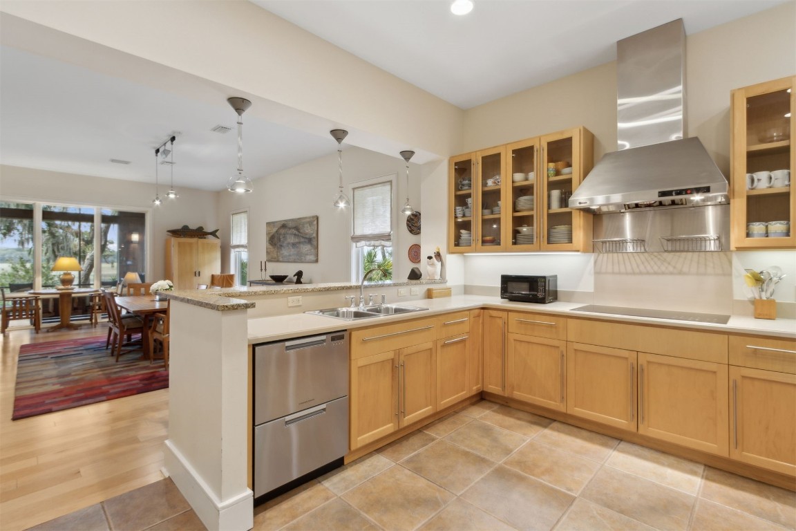 10 Sea Marsh Road Amelia Island, FL 32034 - Photo 17 of 78 a kitchen with stainless steel appliances granite countertop a sink and cabinets
