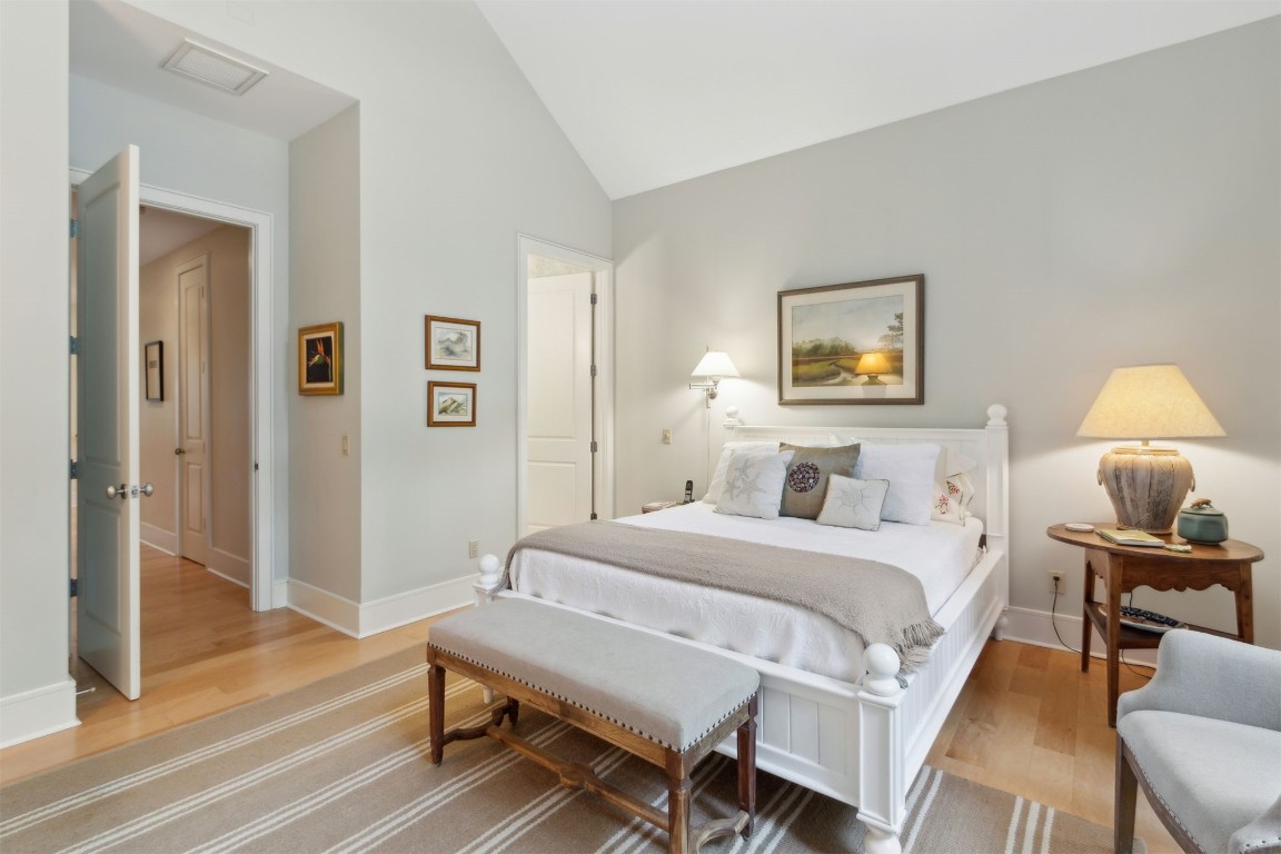 10 Sea Marsh Road Amelia Island, FL 32034 - Photo 21 of 78 a bedroom with a bed and wooden floor