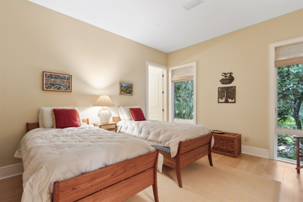 10 Sea Marsh Road Amelia Island, FL 32034 - Photo 23 of 78 a bedroom with two beds and a large window