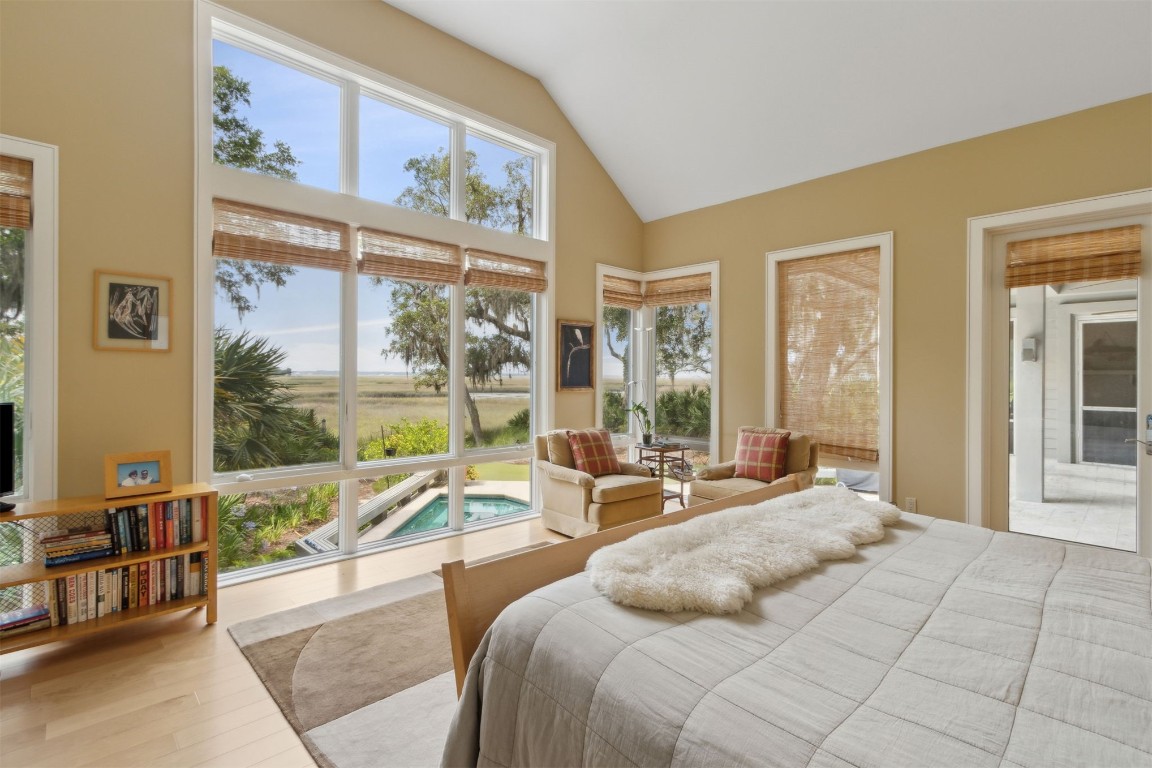 10 Sea Marsh Road Amelia Island, FL 32034 - Photo 25 of 78 a bedroom with a large window and a bed