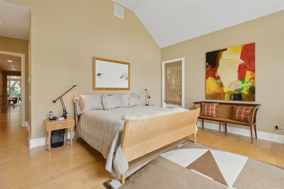 10 Sea Marsh Road Amelia Island, FL 32034 - Photo 27 of 78 a bedroom with a bed and painting on the wall