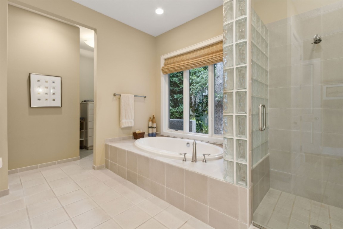 10 Sea Marsh Road Amelia Island, FL 32034 - Photo 31 of 78 a spacious bathroom with a bathtub and a shower