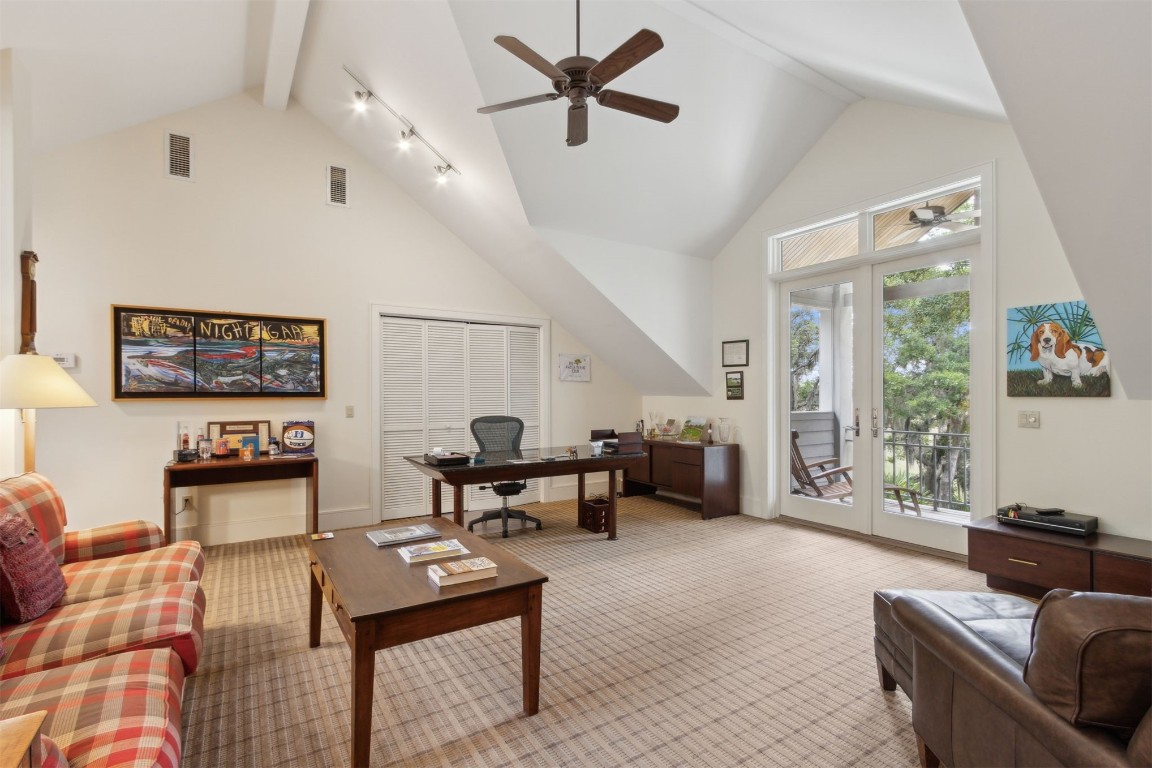 10 Sea Marsh Road Amelia Island, FL 32034 - Photo 32 of 78 a living room with furniture and a large window