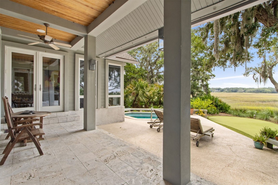10 Sea Marsh Road Amelia Island, FL 32034 - Photo 41 of 78 a view of a patio with table and chairs and potted plants