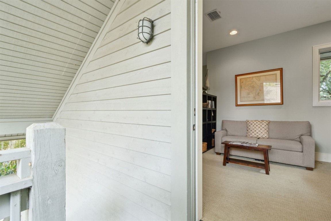 10 Sea Marsh Road Amelia Island, FL 32034 - Photo 51 of 78 a living room with furniture and a wall painting