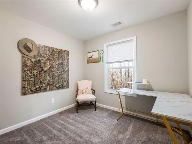 a living room with furniture a window and a table