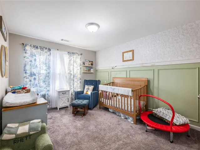 a bedroom with furniture and a window