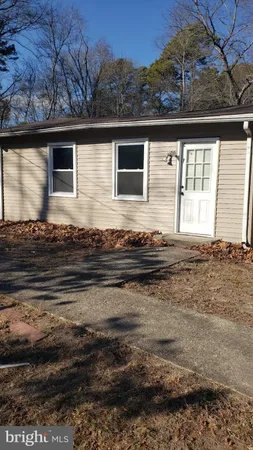 a view of a backyard of the house