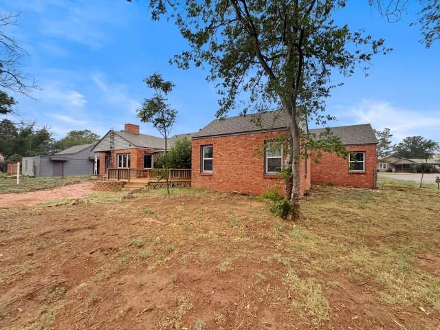 1001 North 3rd Street Lamesa, TX 79331 - Photo 5 of 32 a front view of a house with a yard and garage