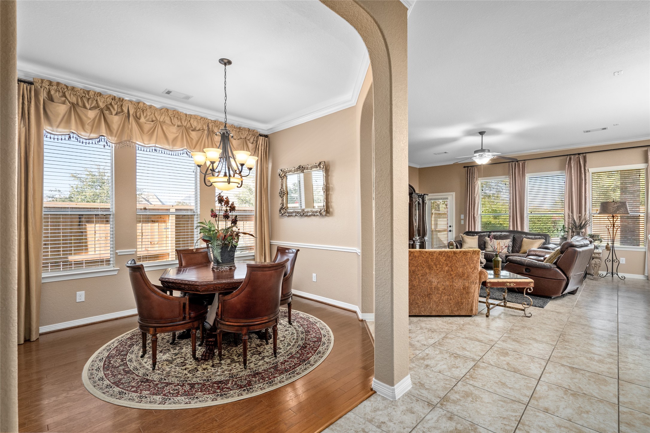 517 West Fork Webster, TX 77598 - Photo 5 of 28 a dining room with furniture a chandelier and wooden floor