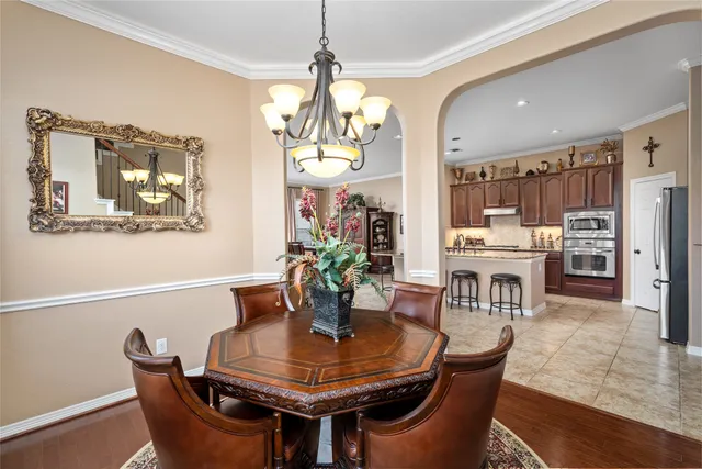 a kitchen with appliances cabinets and furniture