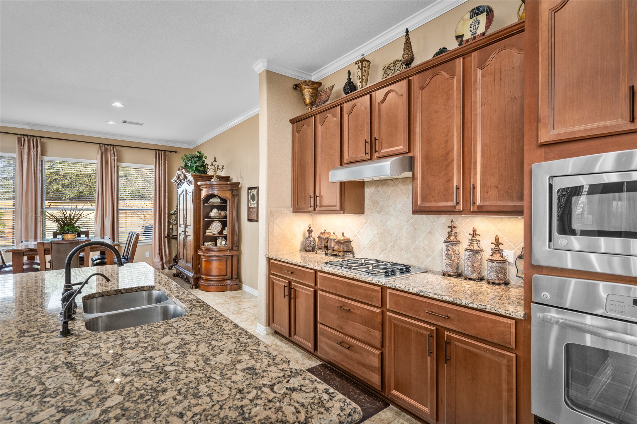 517 West Fork Webster, TX 77598 - Photo 10 of 28 a kitchen with stainless steel appliances granite countertop a sink stove and cabinets