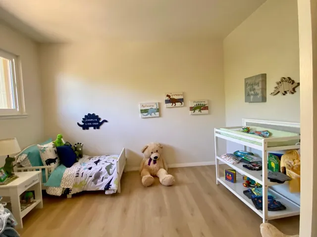 a bed room with a bed and a window