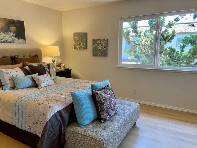 a bedroom with bed and window