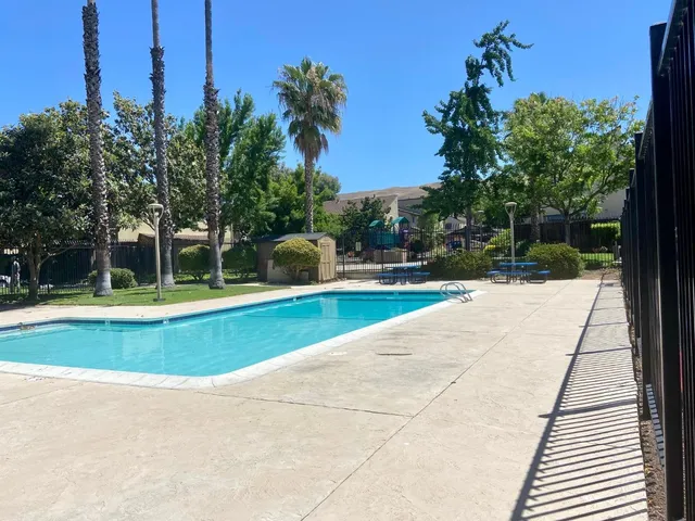 a view of swimming pool with a yard
