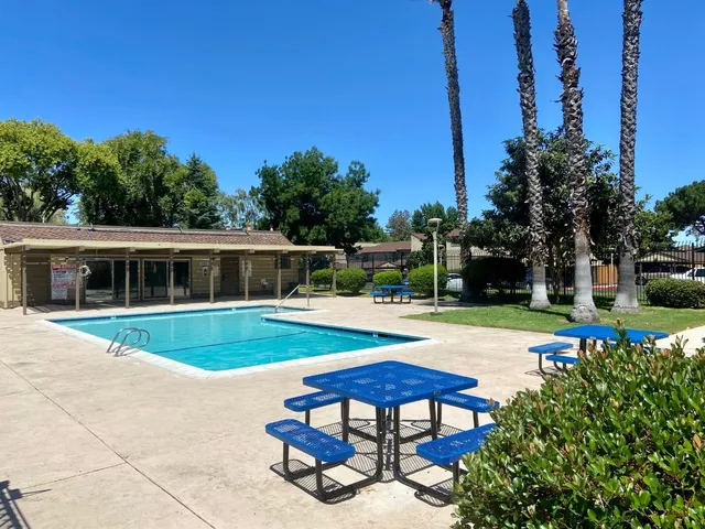 a view of a swimming pool with a patio