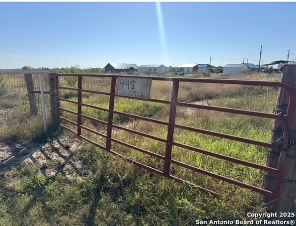 a view of a yard next to a yard