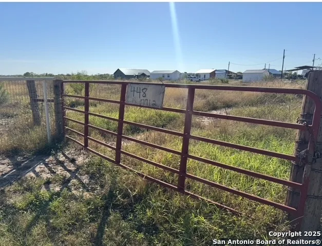 a view of a yard next to a yard