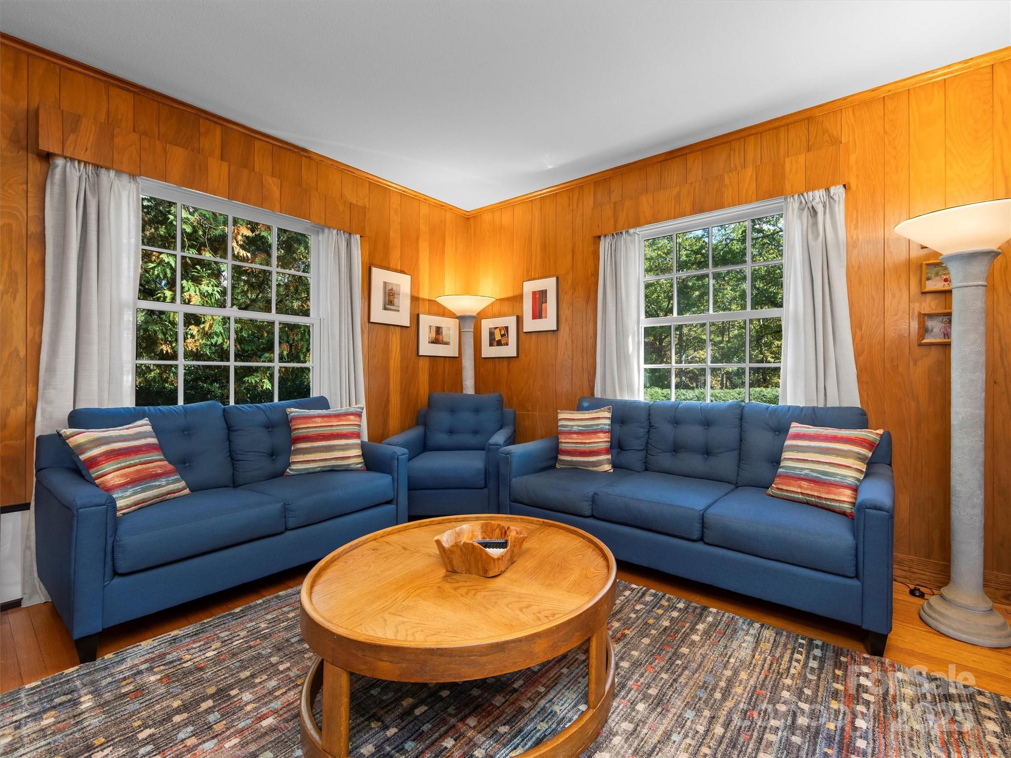 7 Park Road Asheville, NC 28803 - Photo 11 of 48 a living room with furniture a table and a potted plant