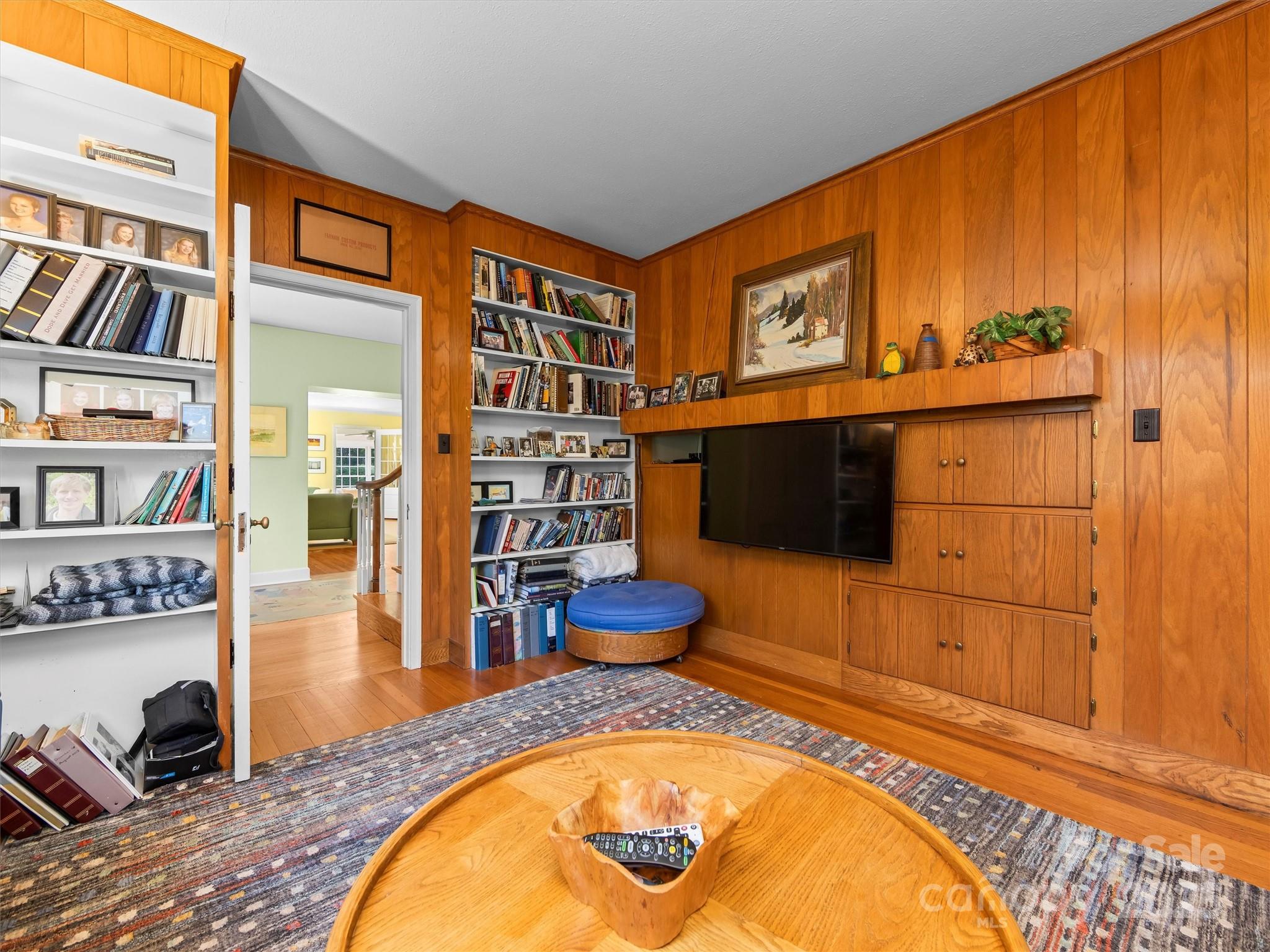 7 Park Road Asheville, NC 28803 - Photo 13 of 48 a living room with furniture a flat screen tv and a rug