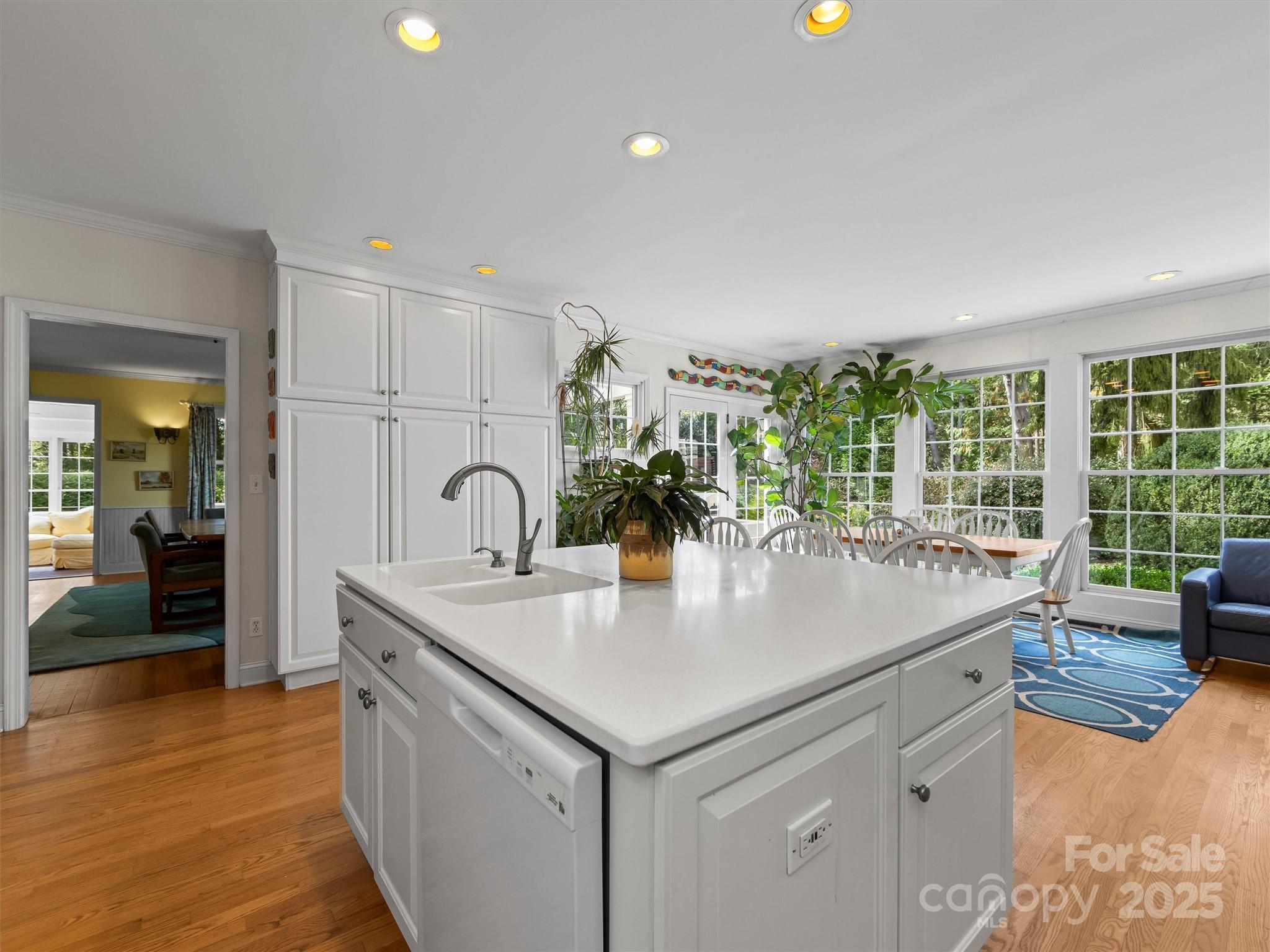7 Park Road Asheville, NC 28803 - Photo 16 of 48 a view of kitchen island a sink and wooden floor