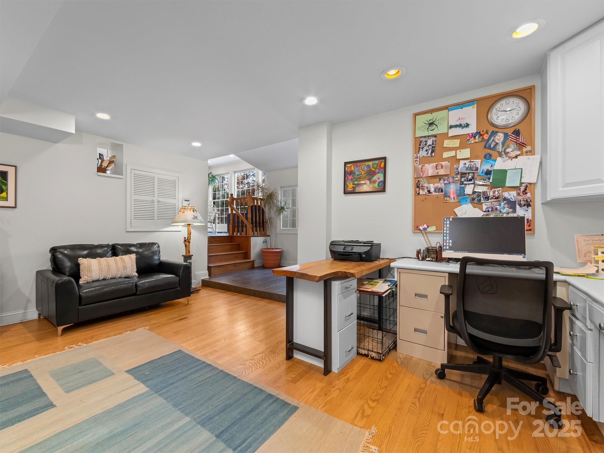 7 Park Road Asheville, NC 28803 - Photo 21 of 48 a workspace with furniture and a rug