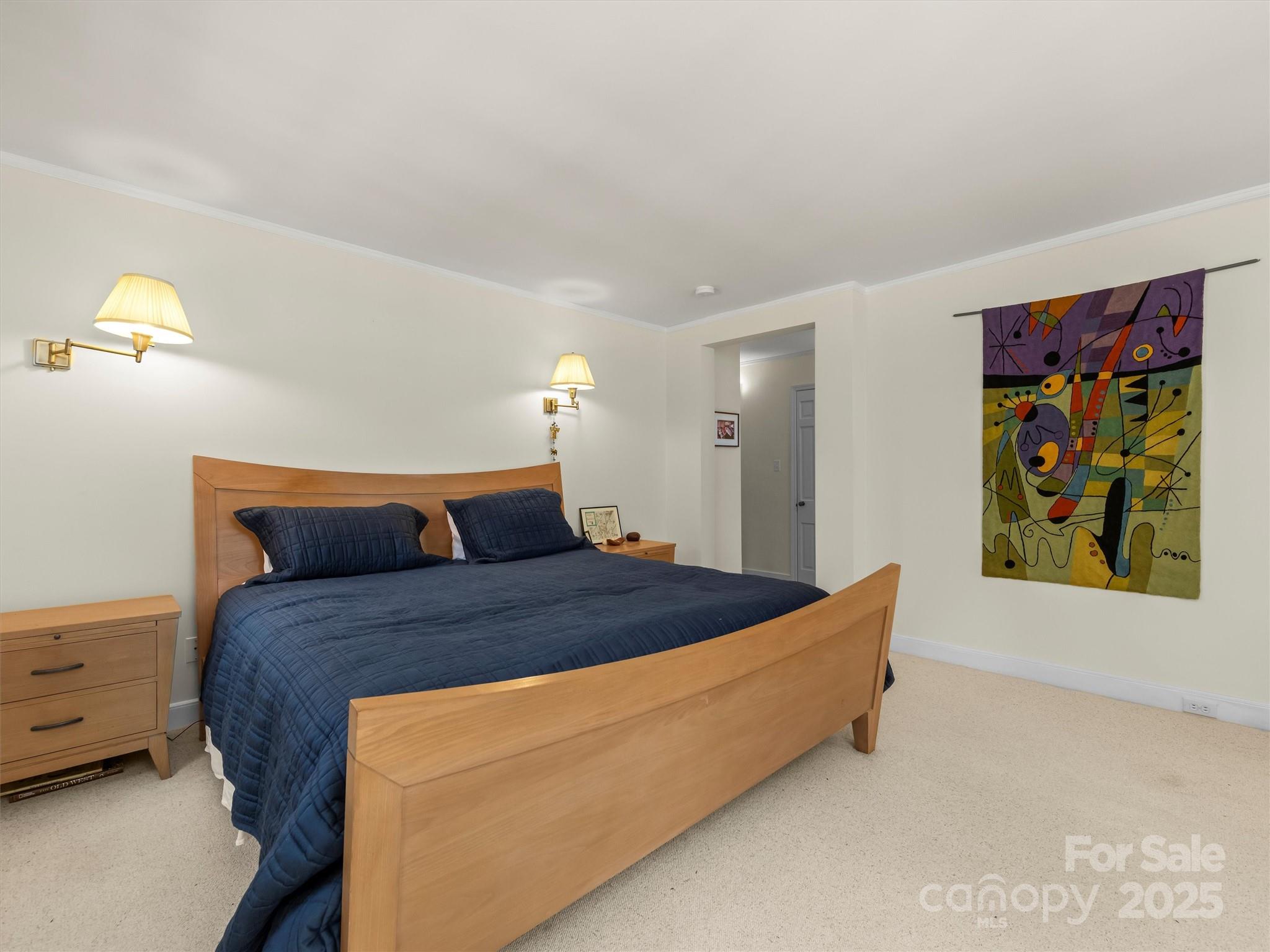 7 Park Road Asheville, NC 28803 - Photo 25 of 48 a bed sitting in a bedroom next to a window
