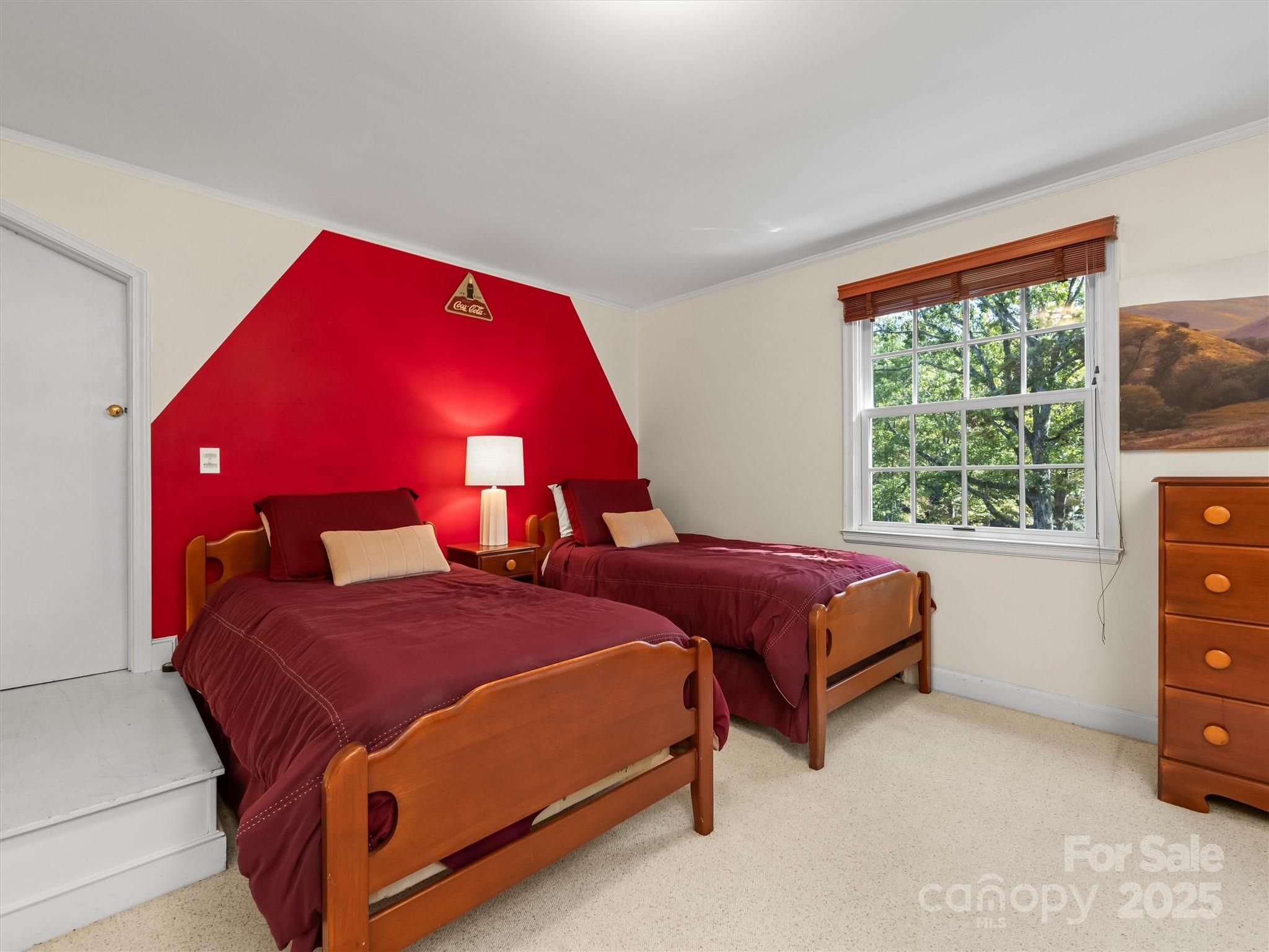 7 Park Road Asheville, NC 28803 - Photo 29 of 48 a bedroom with a bed and a window